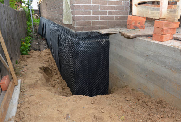 Happy homeowners after waterproofing job in South Byron